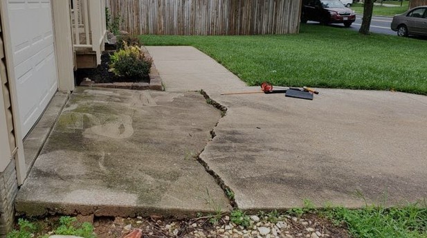 concrete driveway slab that needs to be raised